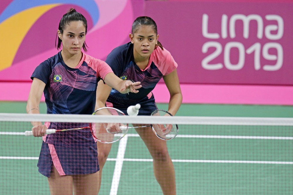 Doubles pair focused at the net late in a game