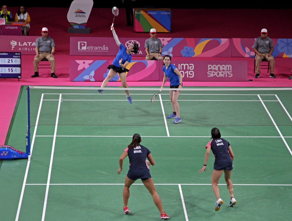 Doubles match with players near the net