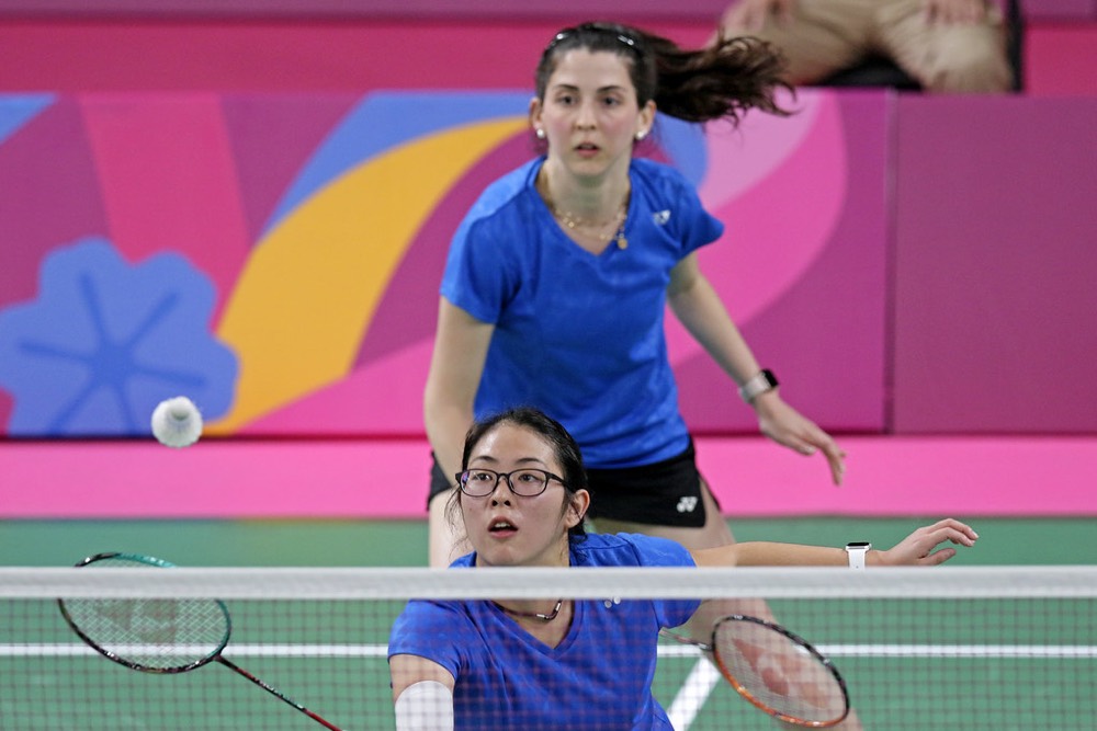 Doubles players ready at the net for a fast exchange