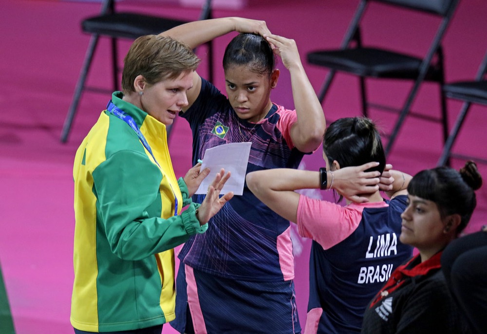Players listening to their coach during a match