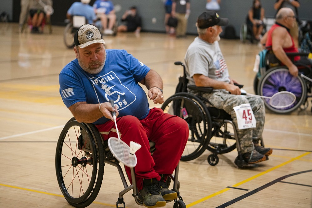 Wheelchair badminton players competing