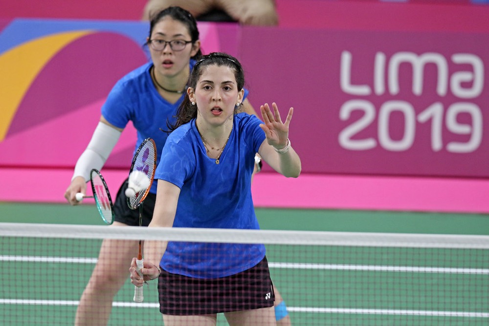 Doubles players at the net after the serve