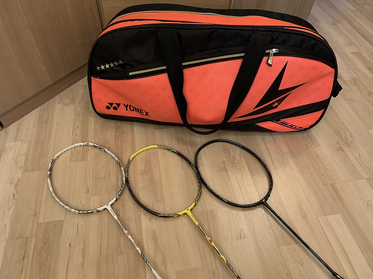 Professional badminton tour kit bag and tournament rackets prepared for match play