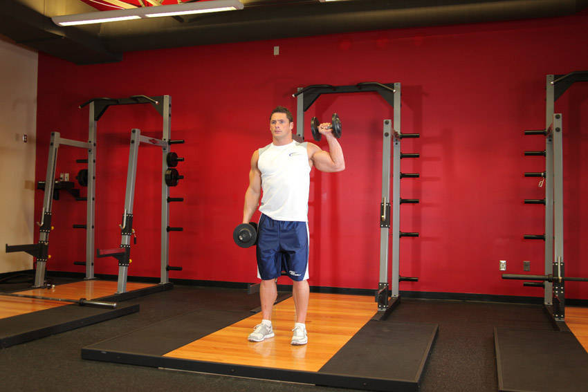 Half-kneeling dumbbell press: start position